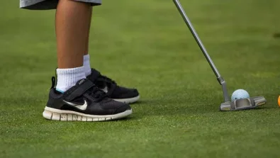 Pine Ridge camper putting on practice green