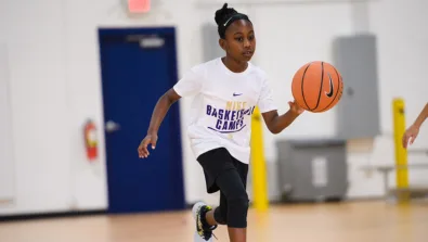 Girl looking up toward basket