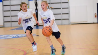 2 girls playing scrimmage