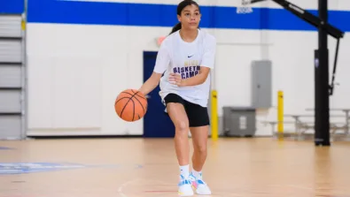 Single girl dribbling looking up