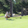 Nike Junior Golf Camp lining up putt png