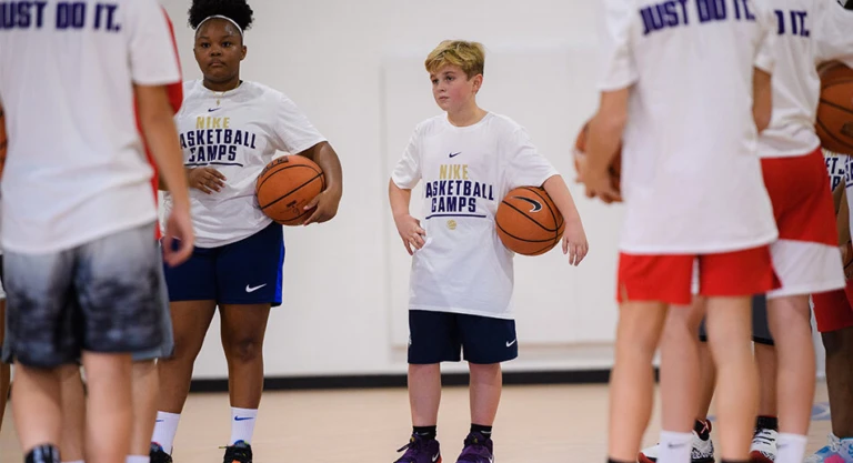 Coed listening to coach