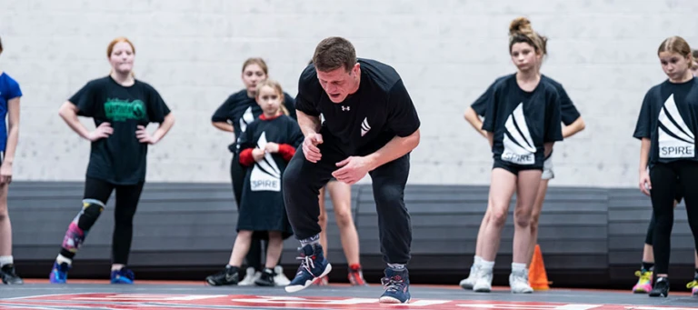 Wrestling Coach Instruction Feature Image