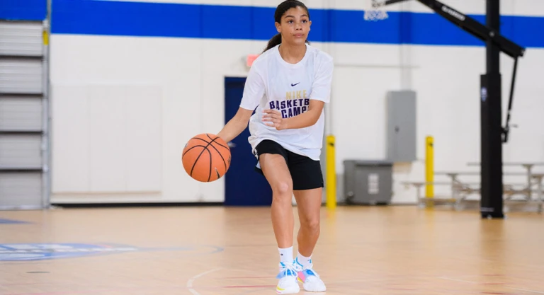 Single girl dribbling looking up