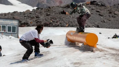 High Cascade Snowboard Camp coach films camper learning tube jpg