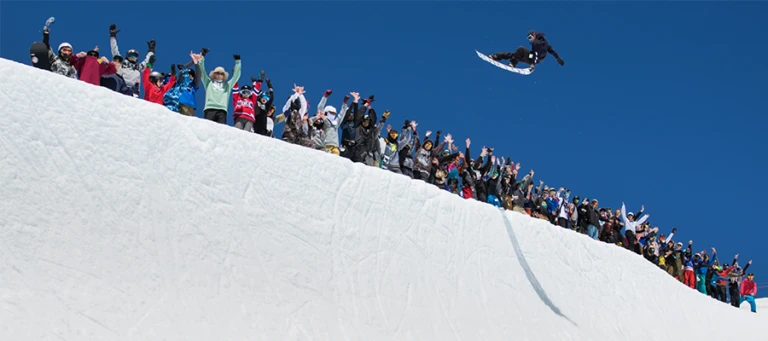 High Cascade Snowboarding Camp staff airing out of pipe jpg