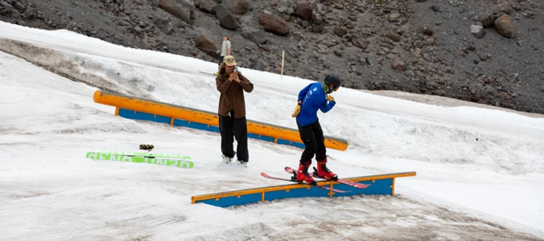 Windells Ski Camp camper learns to ride flat bar with coaches help jpg