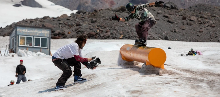 High Cascade Snowboard Camp coach films camper learning tube jpg