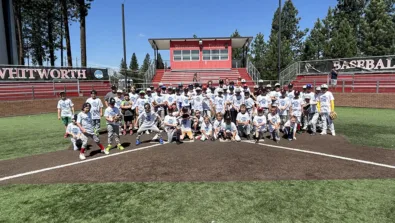 Campers pose for photo at home plate