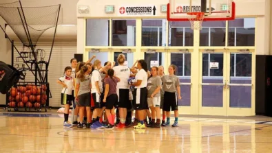 WJU girls nike basketball camp team huddle at the summer youth basketball camp