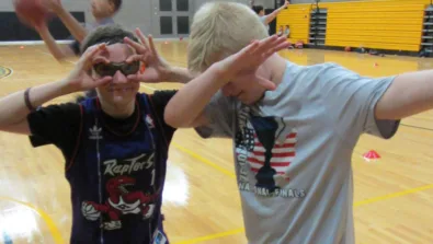 Framingham State University Action Pose and campers being silly.