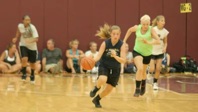 Suny Potsdam youth basketball camper running a fast break drill