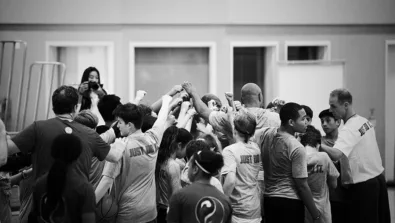 Si Team Huddle at the youth basketball camp in San Francisco