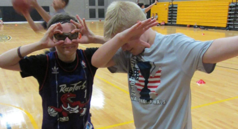 Framingham State University Action Pose and campers being silly.