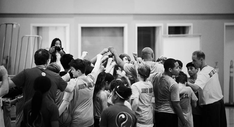Si Team Huddle at the youth basketball camp in San Francisco