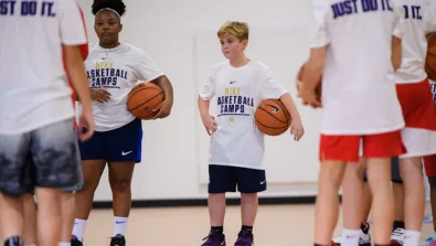 Coed listening to coach