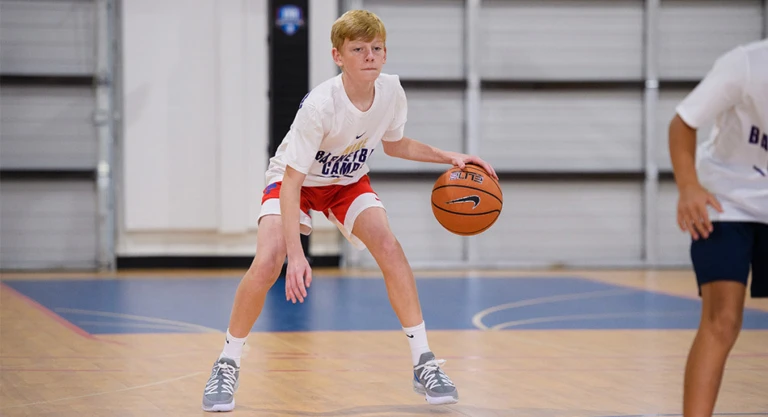 Single boy dribbling