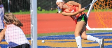 Worcester State Field Hockey Girl Hitting Ball