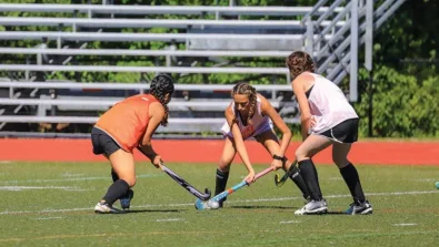 Worcester State Field Hockey Girl Trapping Ball