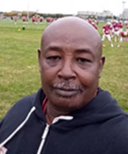 Charles (“Coach Chuck”) Farrell - Camp Director