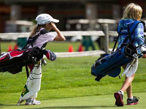 Nike Junior Golf Camps walking on green png