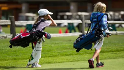 Nike Junior Golf Camps walking on green png