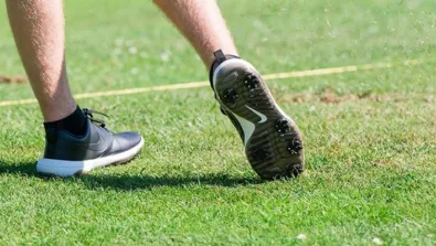 Nike Junior Golf Camp tee shot close up grass flying png