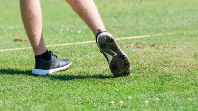 Nike Junior Golf Camp tee shot close up grass flying