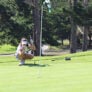 Nike Junior Golf Camp lining up putt png