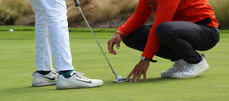 Low teaching ratio putting nike junior golf camp png