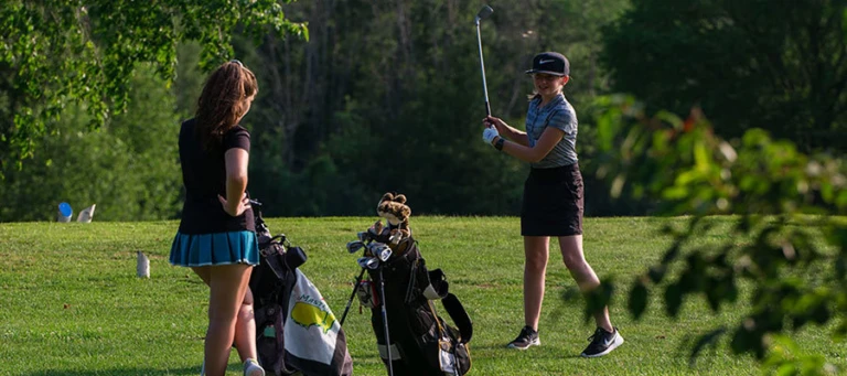 Nike Junior Golf Camp girls tee shot practice png