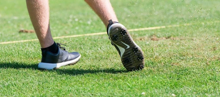 Nike Junior Golf Camp tee shot close up grass flying png