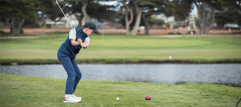 Nike Junior Golf Camp tee shot over water png