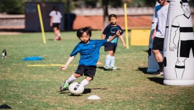 Young Boy Kicking Ball2