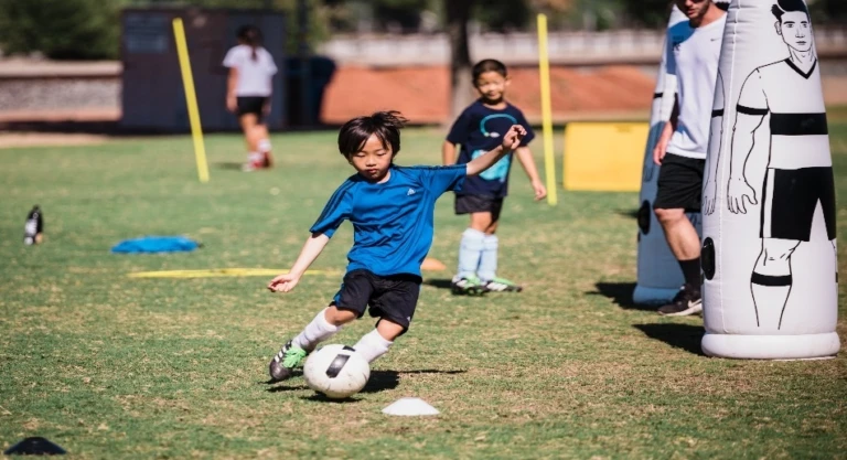 Young Boy Kicking Ball2