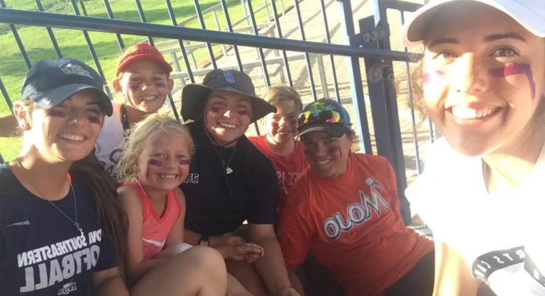 Campers smile for selfie at Nike Softball Camp