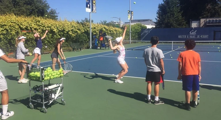 Cal Tennis Campers Serving