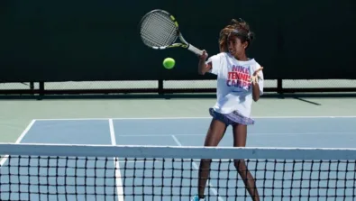 Tennis girl forehand at net