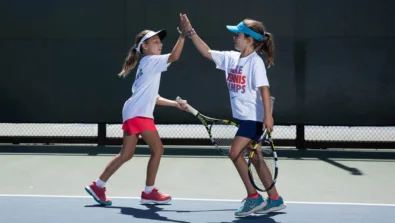 Tennis girls high five