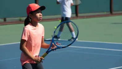 Tennis gril ready stance at net