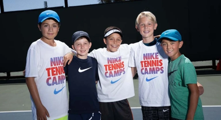 Tennis boys group smiling