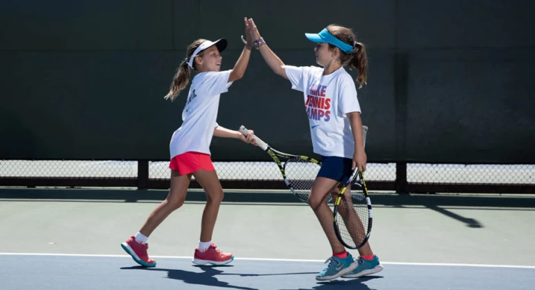 Tennis girls high five