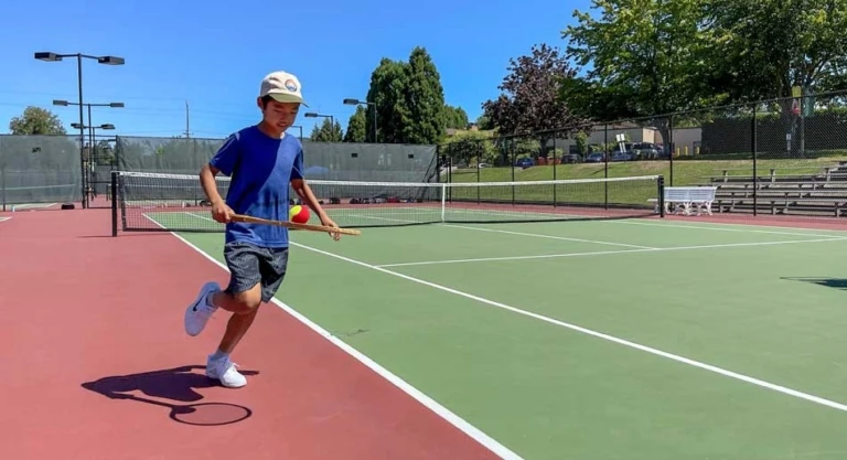 Oregon elite jesuit camper fitness ball on racquet 1